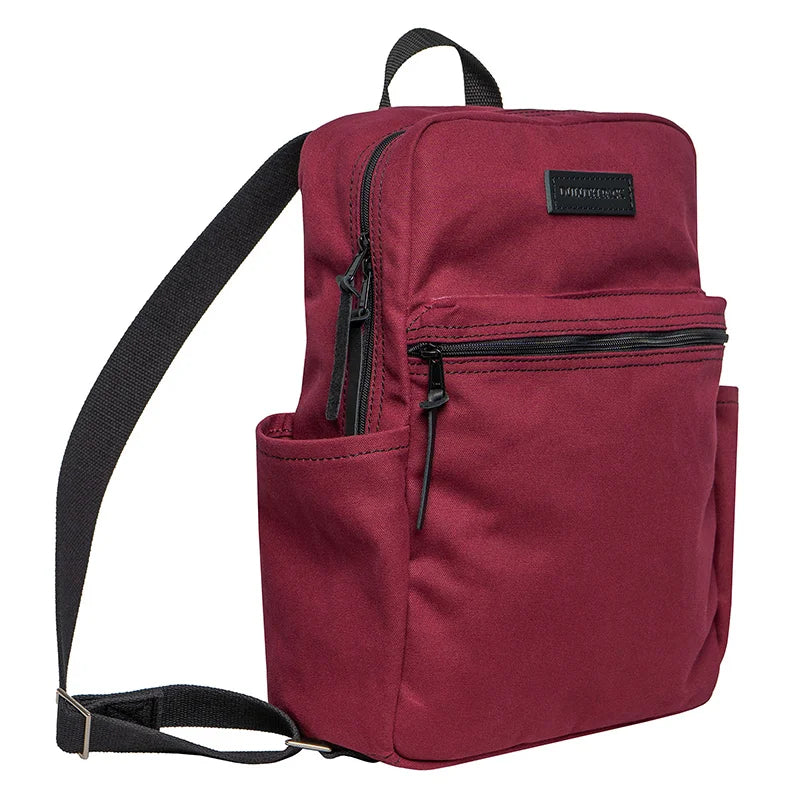 NEW Limited Edition Lake Huron Standard Backpack in deep red canvas with black straps, featuring side pockets and durable design for outdoor use.