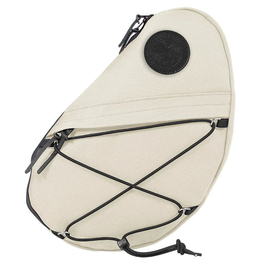 Sling Pack in natural waxed canvas with black leather details, featuring durable handmade construction by Duluth Pack, designed for versatile outdoor use.