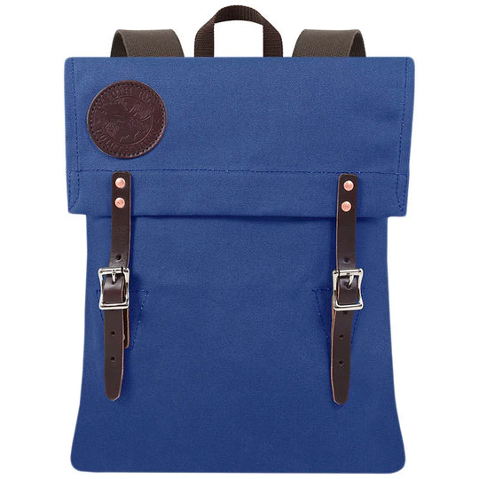 Scout Pack in royal blue canvas with leather straps, designed for durable outdoor use, reflecting heritage craftsmanship and rugged style by Duluth Pack.