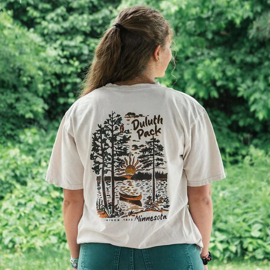 Duluth Pack Canoe Adventure T-Shirt in cappuccino color by LAKESHIRTS, INC., featuring soft cotton fabric and Northern Minnesota canoe graphics, perfect for outdoor enthusiasts.
