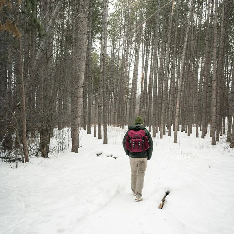 Lake Huron Wanderer in Burgundy and Black Trim and Worded Logo on Model in Woods and Snow