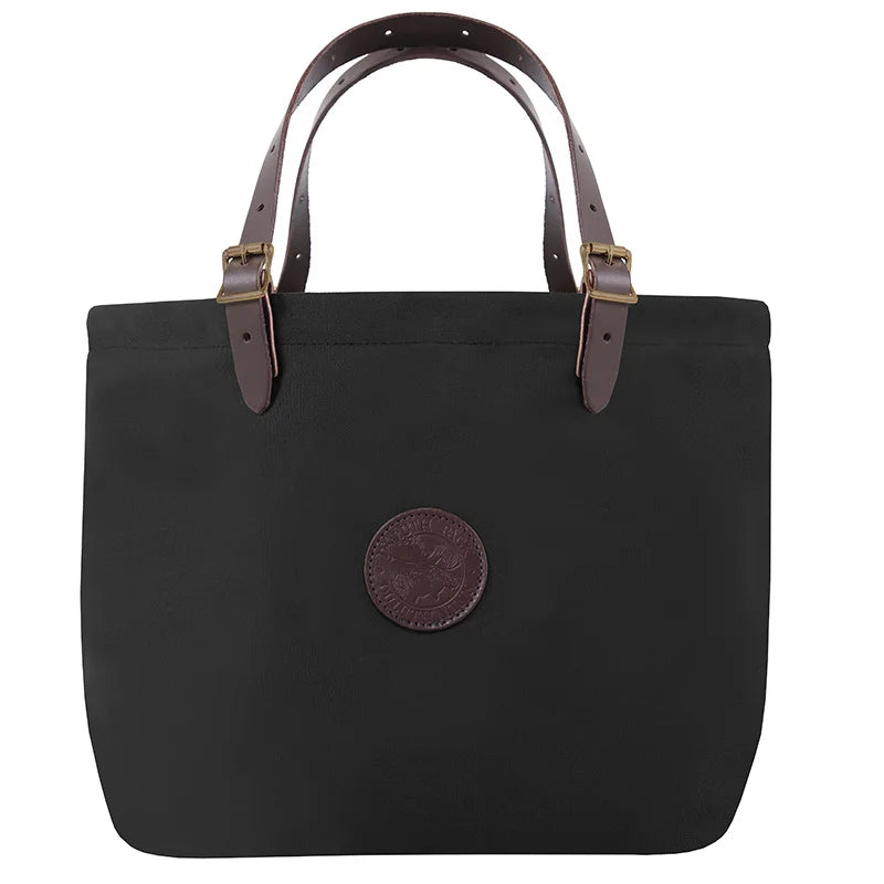 Market Tote in black rugged 15oz canvas with adjustable premium leather handles and antique brass hardware, designed for durable outdoor use by Duluth Pack.