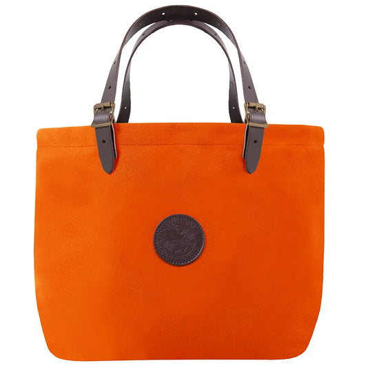 Market Tote in bright orange with adjustable premium leather handles and antique brass hardware, crafted for durability and rugged outdoor use by Duluth Pack.
