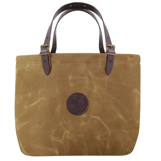 Market Tote in waxed khaki canvas with adjustable leather handles and antique brass hardware, handcrafted by Duluth Pack for rugged outdoor use.