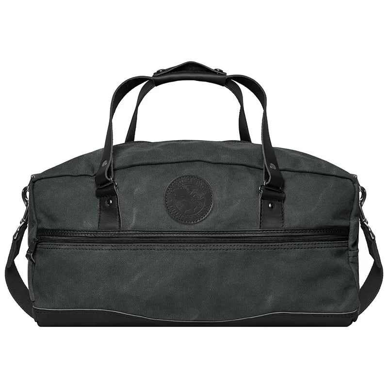 Weekender Duffel in Waxed Grey canvas with handcrafted leather bottom and handles, perfect for rugged outdoor travel by Duluth Pack.