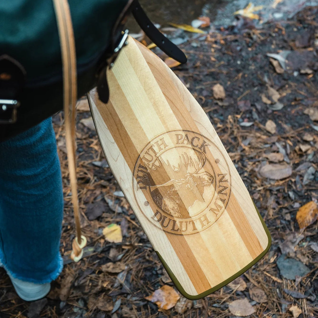 A Bending Branches BB Special 11 Canoe Paddle that is engraved with the Duluth Pack canoing brand logo. 