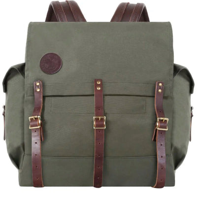 #3 Monarch Pack - 54 L in durable olive canvas with rich brown leather straps, showcasing handcrafted rugged outdoor design by Duluth Pack for adventure use.