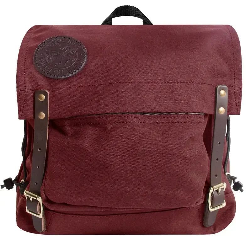 Duluth Pack Portage Pack in burgundy with white background