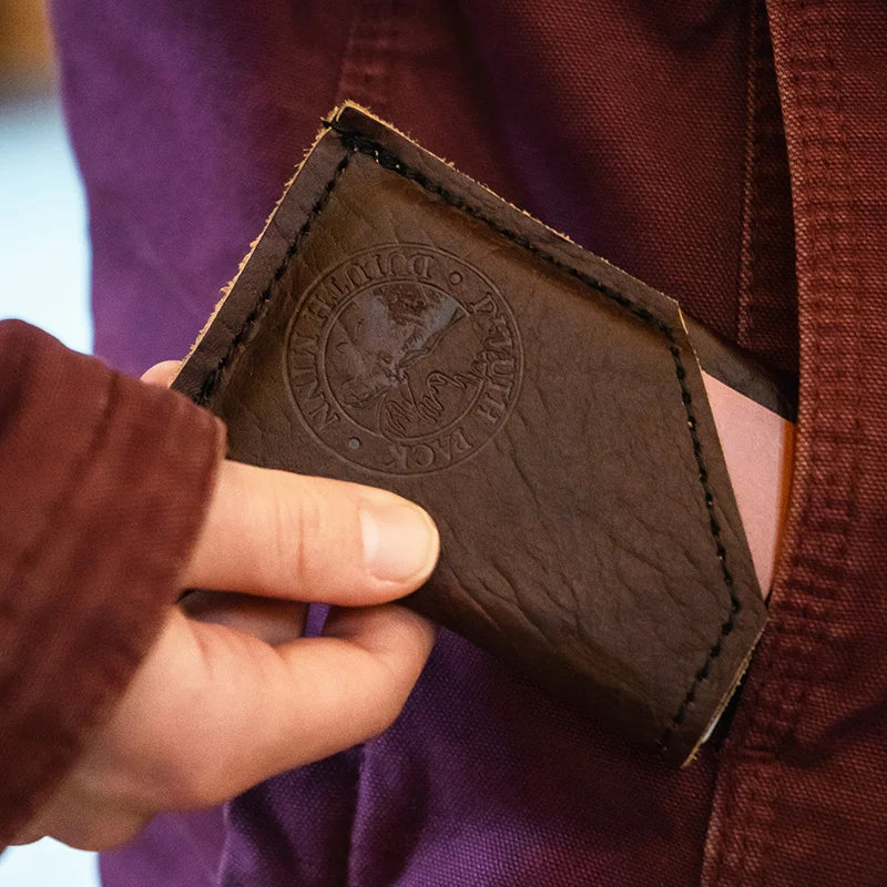 Bison Leather Card Sleeve being put in pocket