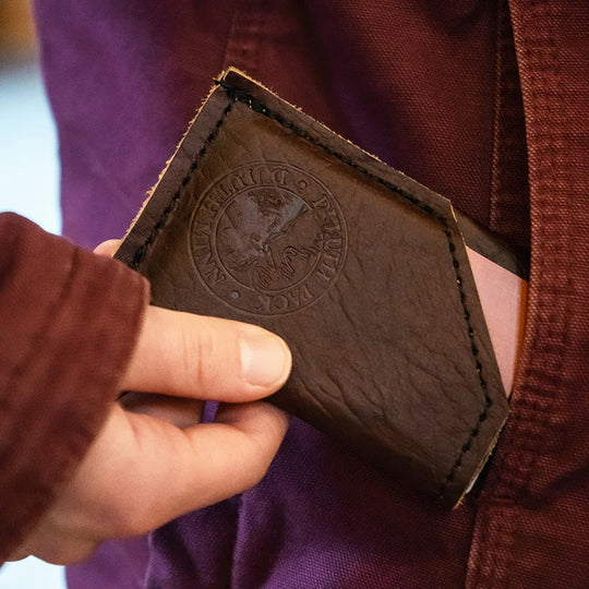 Bison Leather Card Sleeve being put in pocket